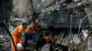 Pakistan rescuers scour blaze site for dozens missing