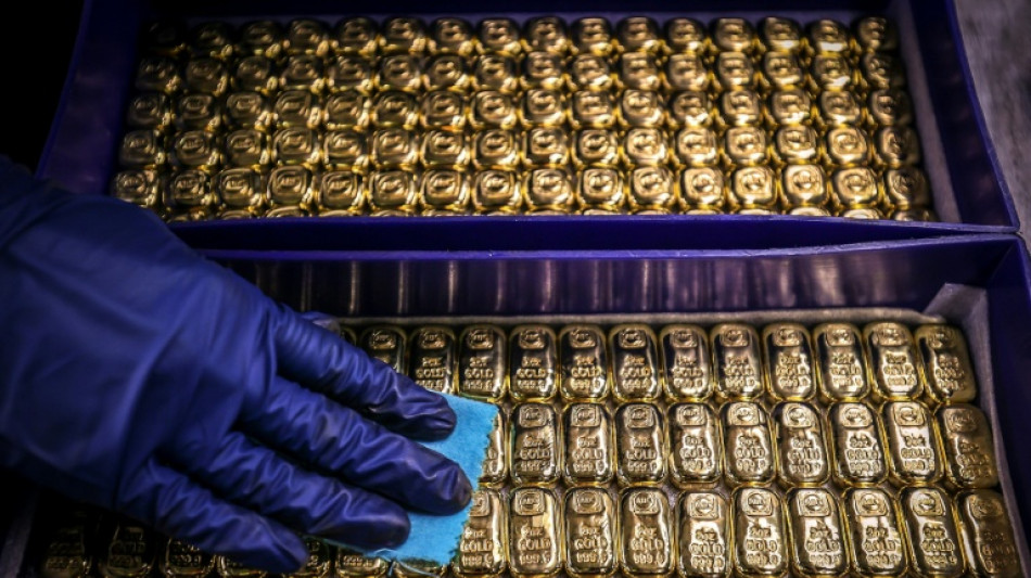 Precious metals fall again, Asian stocks swing as traders wind down