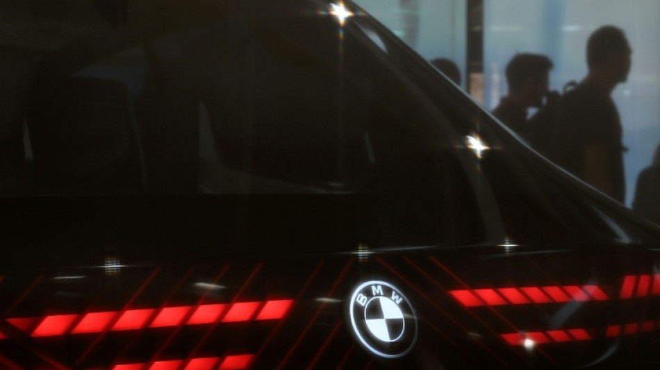 BMW says can weather tariff storm despite profit plunge