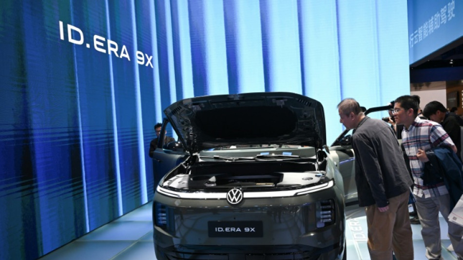 Volkswagen warns of more cost cuts as profits plunge