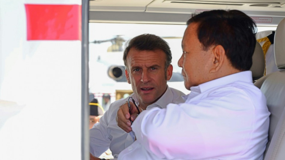 Macron decorates Indonesia leader before Buddhist temple visit