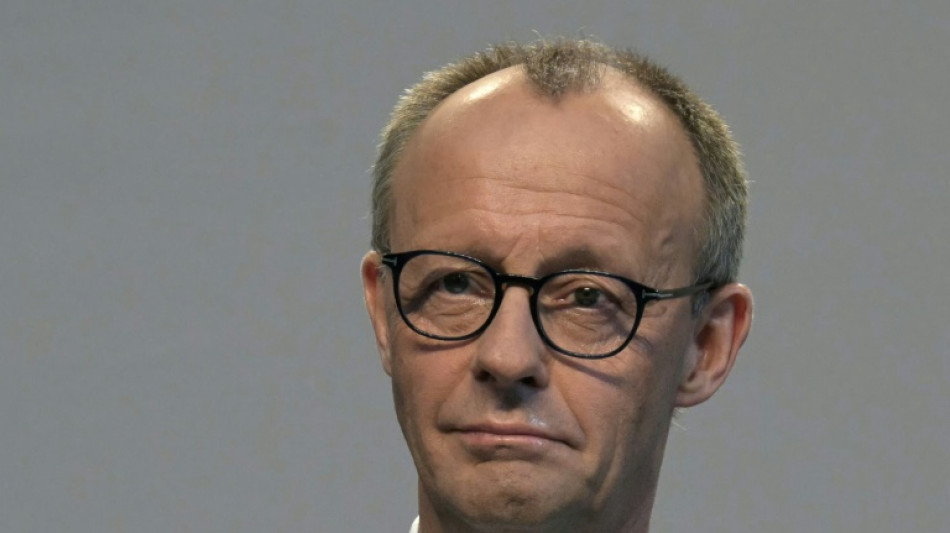 Germany 'back on track' says Merz, unveiling new coalition